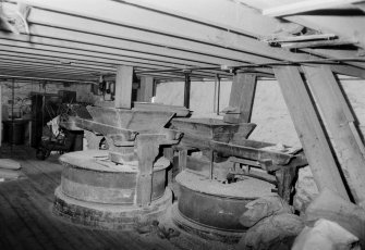 General interior view, looking SW at millstones