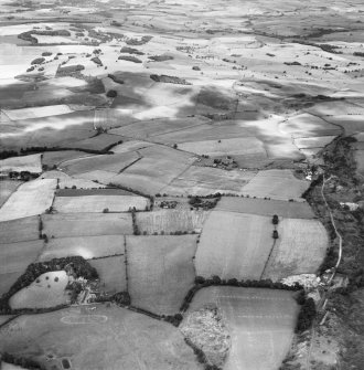 Parish of Cults, general view, showing Cults Hill Limestone Quarry and Cults Farm.  Oblique aerial photograph taken facing east.