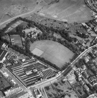 Edinburgh, general view, showing St Leonard's Hall, Holyrood Park Road and Salisbury Green, Dalkeith Road.  Oblique aerial photograph taken facing east.  This image has been produced from a damaged and crop marked negative.