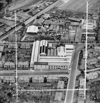 Lawside Engineering and Foundry Co. Ltd. and McGregor and Balfour Ltd. North Tay Works, Loon's Road, Dundee.  Oblique aerial photograph taken facing north.  This image has been produced from a crop marked negative.