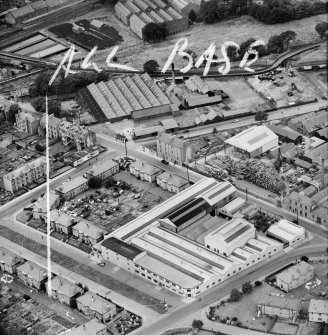 Lawside Engineering and Foundry Co. Ltd. and Kings Cross Works, Loon's Road, Dundee.  Oblique aerial photograph taken facing north-west.  This image has been produced from a crop marked negative.