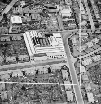Lawside Engineering and Foundry Co. Ltd. and McGregor and Balfour Ltd. North Tay Works, Loon's Road, Dundee.  Oblique aerial photograph taken facing north.  This image has been produced from a crop marked negative.