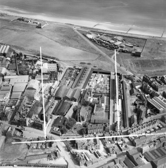 John Fleming and Co. Ltd. Timber Yard and East St Clement's Church, St Clement Street, Aberdeen.  Oblique aerial photograph taken facing north-east.  This image has been produced from a crop marked negative.