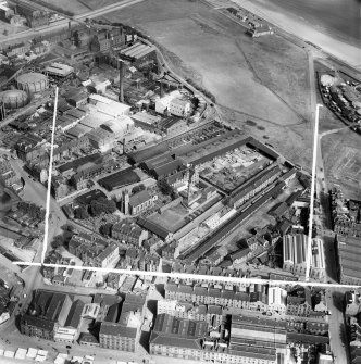 Aberdeen, general view, showing John Fleming and Co. Ltd. Timber Yard and East St Clement's Church, St Clement Street.  Oblique aerial photograph taken facing north.  This image has been produced from a crop marked negative.