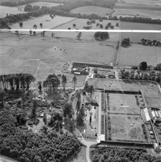 Newbyth Mains and Walled Garden, Whitekirk.  Oblique aerial photograph taken facing west.  This image has been produced from a crop marked negative.