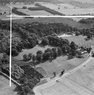 Newbyth Farm and Stables, Whitekirk.  Oblique aerial photograph taken facing south.  This image has been produced from a crop marked negative.