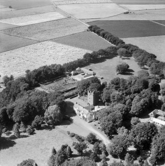 Affleck Castle and Home Farm, Monikie.  Oblique aerial photograph taken facing north-west.