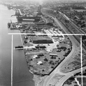 Dundee, general view, showing former Seaplane Base and Caledon Shipyard, Stannergate Road.  Oblique aerial photograph taken facing west.  This image has been produced from a crop marked negative.