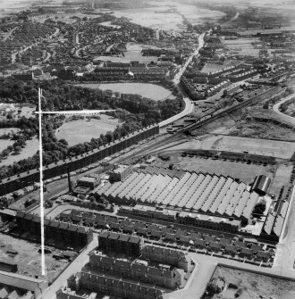 Glasgow, general view, showing Macfarlane, Lang and Co. Victoria Biscuit Works, Clydeford Drive and Tolcross Park.  Oblique aerial photograph taken facing east.  This image has been produced from a crop marked negative.