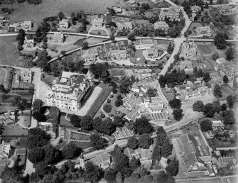 Strathpeffer, general view, showing Highland Hotel and Strathpeffer Free Church.  Oblique aerial photograph taken facing north.
