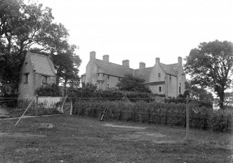 General view of Muchalls Castle and The Hangman's House.