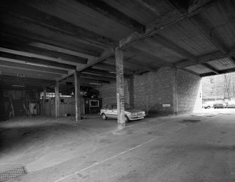 View of the pend of the C&J Brown's warehouse seen from within the pend from the West.