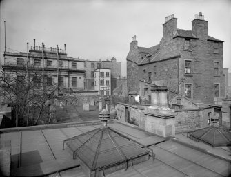 East elevation, showing part of Calton Hill Burial Ground and old Tenement at 15 Calton Hill, Edinburgh.