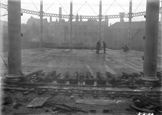 View of new crown sheeting to Number 4 gas holder under construction, with tenement in Holyrood Road visible in background,  Meadow Flat Gasholder Station, Holyrood Road, Edinburgh.