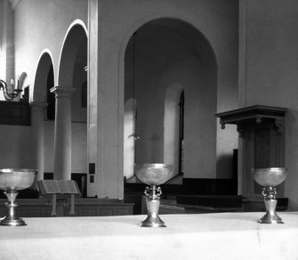 Interior view of Canongate Church, including close up of altar items.