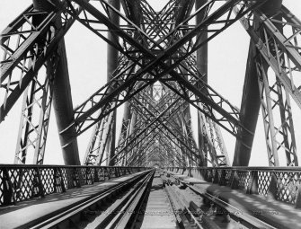 View along the tracks through the structure of the bridge.
Insc. '49 Forth Bridge - The Permanent Way. "Auld Reekie" G.W.W.'
Lantern slide.