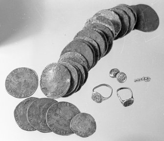 Silver coins and gold jewellery from the wreck-site.