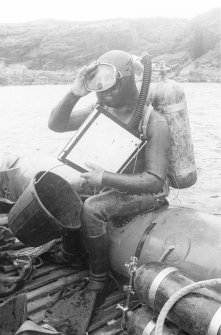 Colin Martin prepares for an excavation stint, with his basic tools of bucket, shovel and drawing-board.