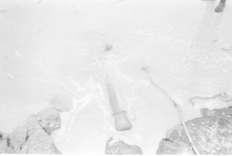 The muzzle of the 6-pounder breaks the surface.