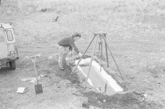 The lifting hoist, removed from the bowser, is now placed over the preservation tank so that the gun can be lowered into it.