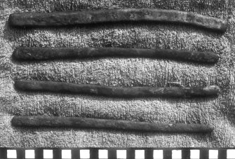 Copper bars, perhaps bullion. They may be examples of the "yellow copper in bundles" noted in the ship's manifest