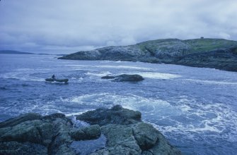 Access to the site was by inflatable boat, seen here approaching Low Rock, photographed from Middle Rock.