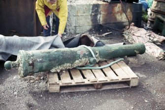 Maritime photographs: Cannon retrieved during the investigation of the wreck, Wrangels Palais. 
(Received with Archaeological Diving Unit (ADU) papers).