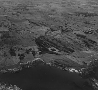 Knockbrex House and Doon Wood, Knockbrex Bay, general view.  Oblique aerial photograph taken facing east.  This image has been produced from a print.