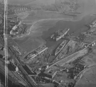 Thomas Ward and Sons Shipbreaking Yard, Inverkeithing.  Oblique aerial photograph taken facing north-east.  This image has been produced from a crop marked print.