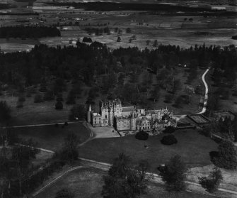 Glamis Castle and Estate.  Oblique aerial photograph taken facing north.  This image has been produced from a print.