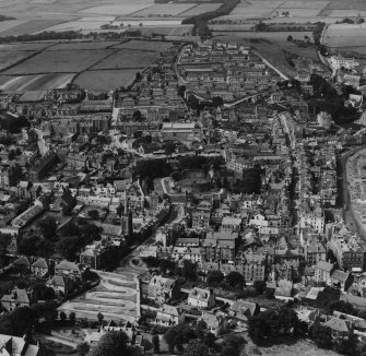 Rothesay, general view, showing Rothesay Castle and Serpentine Road, Isle of Bute.  Oblique aerial photograph taken facing west.  This image has been produced from a print.