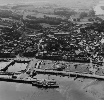 Rothesay, general view, showing Winter Gardens and Rothesay Castle, Isle of Bute.  Oblique aerial photograph taken facing south.  This image has been produced from a print.