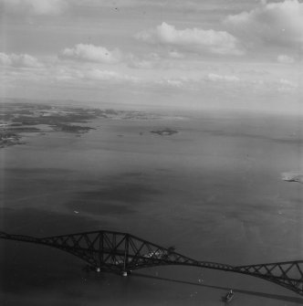 Forth Rail Bridge and Inchcolm, Firth of Forth.  Oblique aerial photograph taken facing east.  This image has been produced from a print.