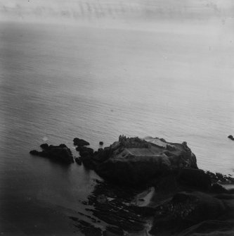 Dunnottar Castle.  Oblique aerial photograph taken facing south-east.  This image has been produced from a print.