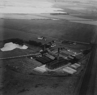 J Tulloch and Co. Ltd. Brick and Tile Works, Pugeston.  Oblique aerial photograph taken facing south-west.  This image has been produced from a print.