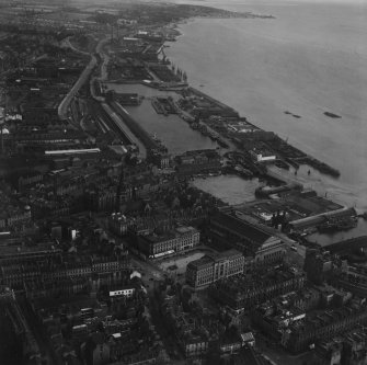 Dundee, general view, showing Caird Hall, City Square and Victoria Dock.  Oblique aerial photograph taken facing east.  This image has been produced from a print.