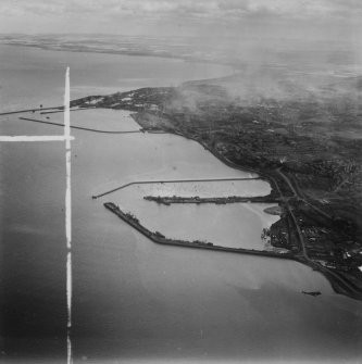 Granton and Leith Harbours, Edinburgh.  Oblique aerial photograph taken facing east.  This image has been produced from a crop marked print. 