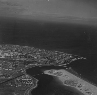 Lossiemouth, general view.  Oblique aerial photograph taken facing north.  This image has been produced from a print. 