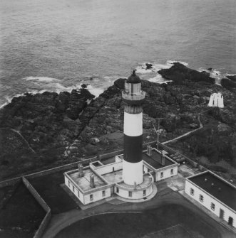 Buchan Ness Lighthouse, Boddam.  Oblique aerial photograph taken facing east.  This image has been produced from a print.