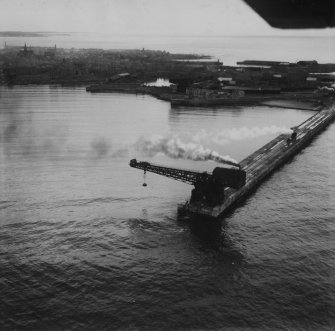 Peterhead, general view, showing Titan Crane on North Breakwater.  Oblique aerial photograph taken facing north.  This image has been produced from a print.