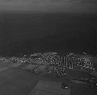 Portknockie, general view.  Oblique aerial photograph taken facing north.  This image has been produced from a print.
