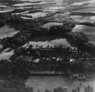 Abbotsford House and Grounds, Melrose.  Oblique aerial photograph taken facing south-east.  This image has been produced from a print.