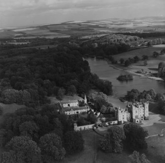 Duns Castle and Hen Poo, Duns Castle Estate.  Oblique aerial photograph taken facing north-east.  This image has been produced from a print.