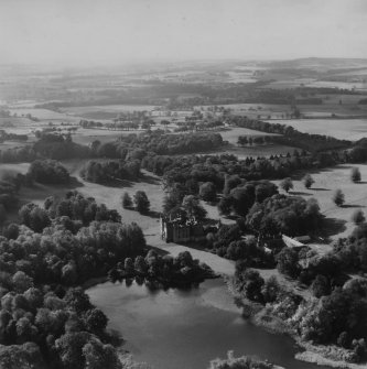 Duns Castle and Estate.  Oblique aerial photograph taken facing south-west.  This image has been produced from a print.