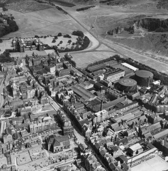 Edinburgh, general view, showing William Younger and Co. Ltd. Holyrood Brewery and Palace of Holyroodhouse.  Oblique aerial photograph taken facing east.  This image has been produced from a crop marked print.