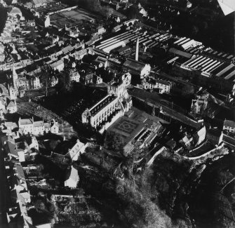 Jedburgh Abbey and Canongate Bridge, Jedburgh.  Oblique aerial photograph taken facing north-east.  This image has been produced from a damaged print.