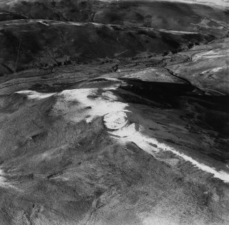 Hindhope Hill Hillfort and Loddan Hill, Cheviot Hills.  Oblique aerial photograph taken facing north-west.  This image has been produced from a print.