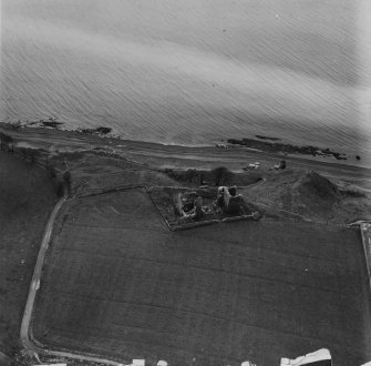 Macduff's Castle, East Wemyss.  Oblique aerial photograph taken facing south-east.  This image has been produced from a print.