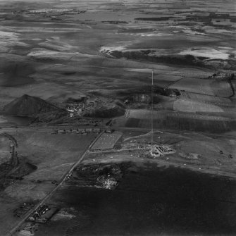 Kirk o'Shotts Transmitting Station, under construction, and Dewshill Colliery.  Oblique aerial photograph taken facing north.  This image has been produced from a print. 