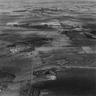 Kirk o'Shotts Transmitting Station, under construction, and Dewshill Colliery.  Oblique aerial photograph taken facing north.  This image has been produced from a print. 